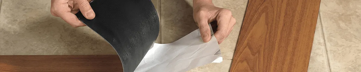 A professional installing vinyl flooring in Fresno, CA